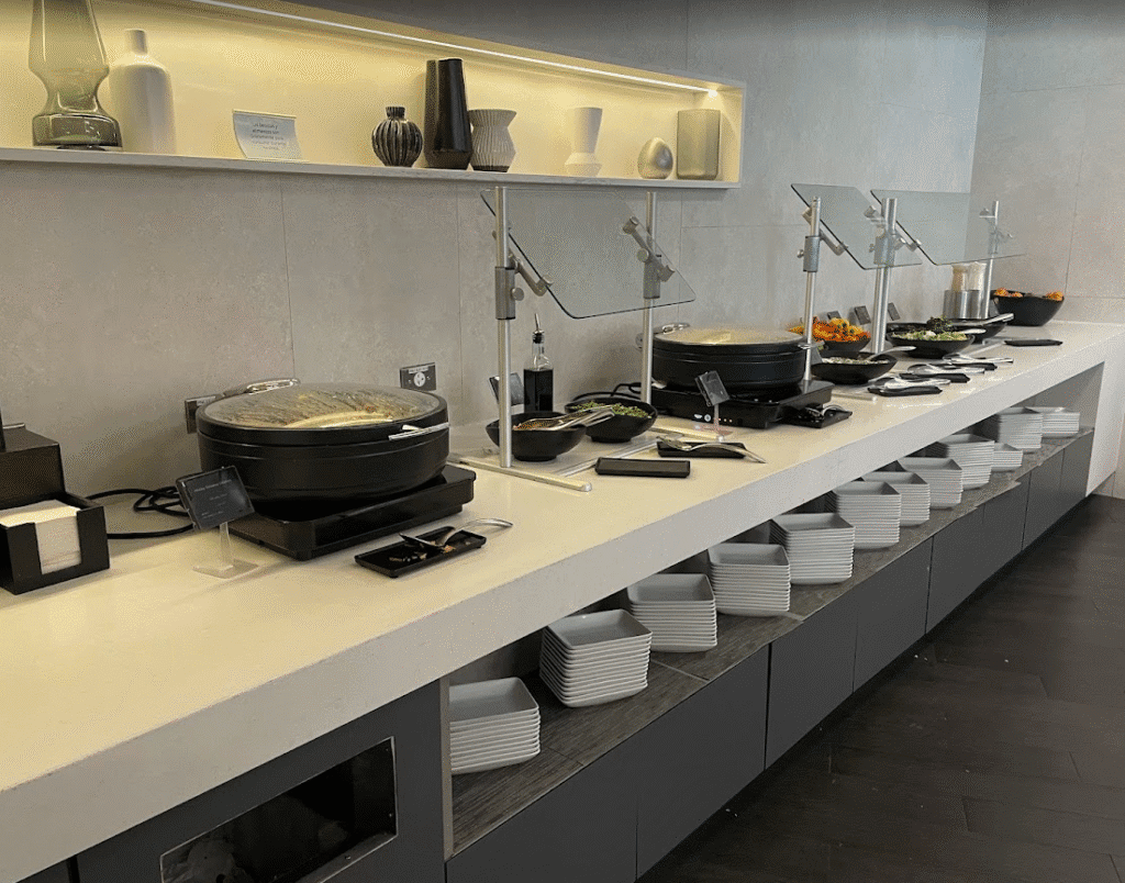 a buffet line with food on the counter