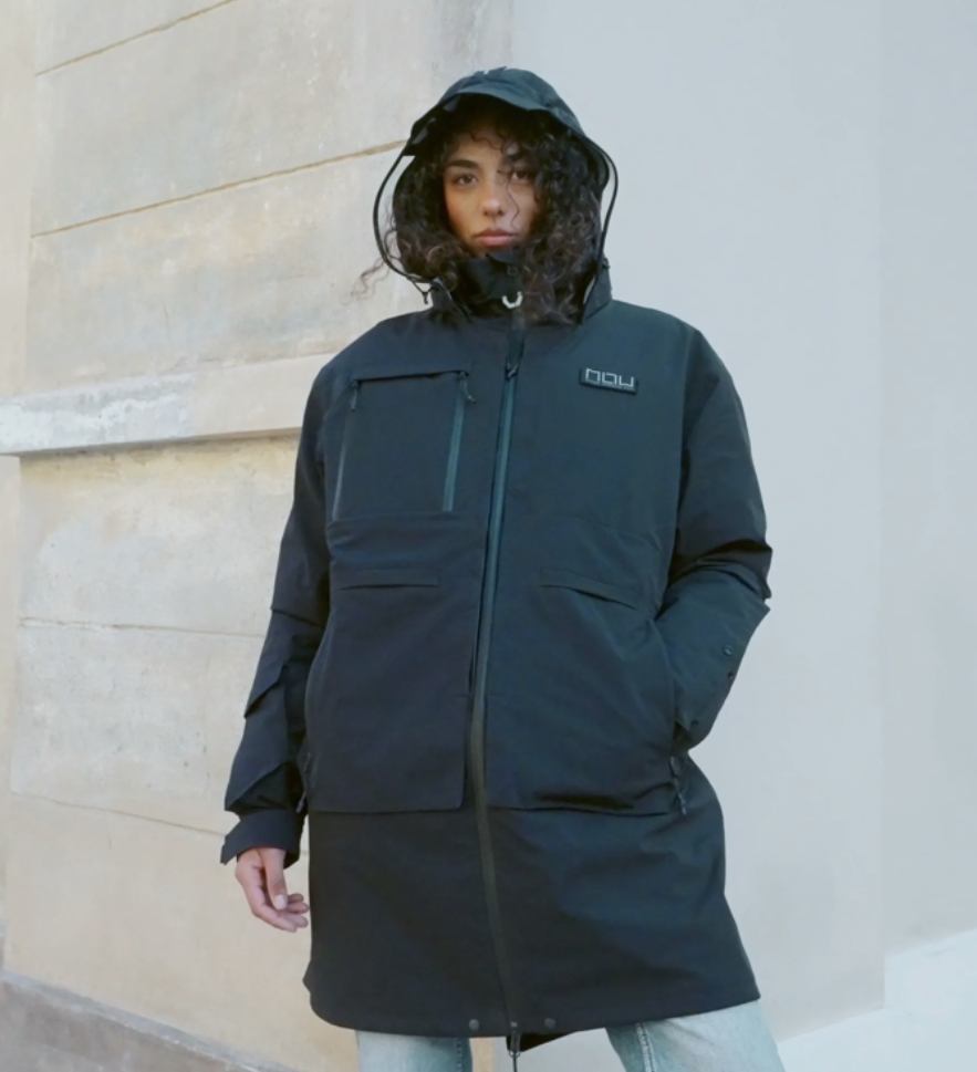 a woman wearing a black coat