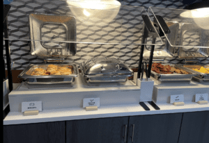 food in a buffet with a glass cover