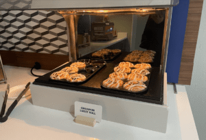 a tray of cinnamon rolls in an oven